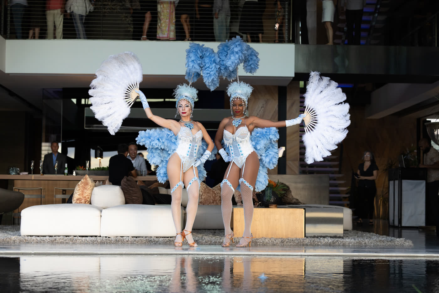 Las Vegas showgirls at an estate event
